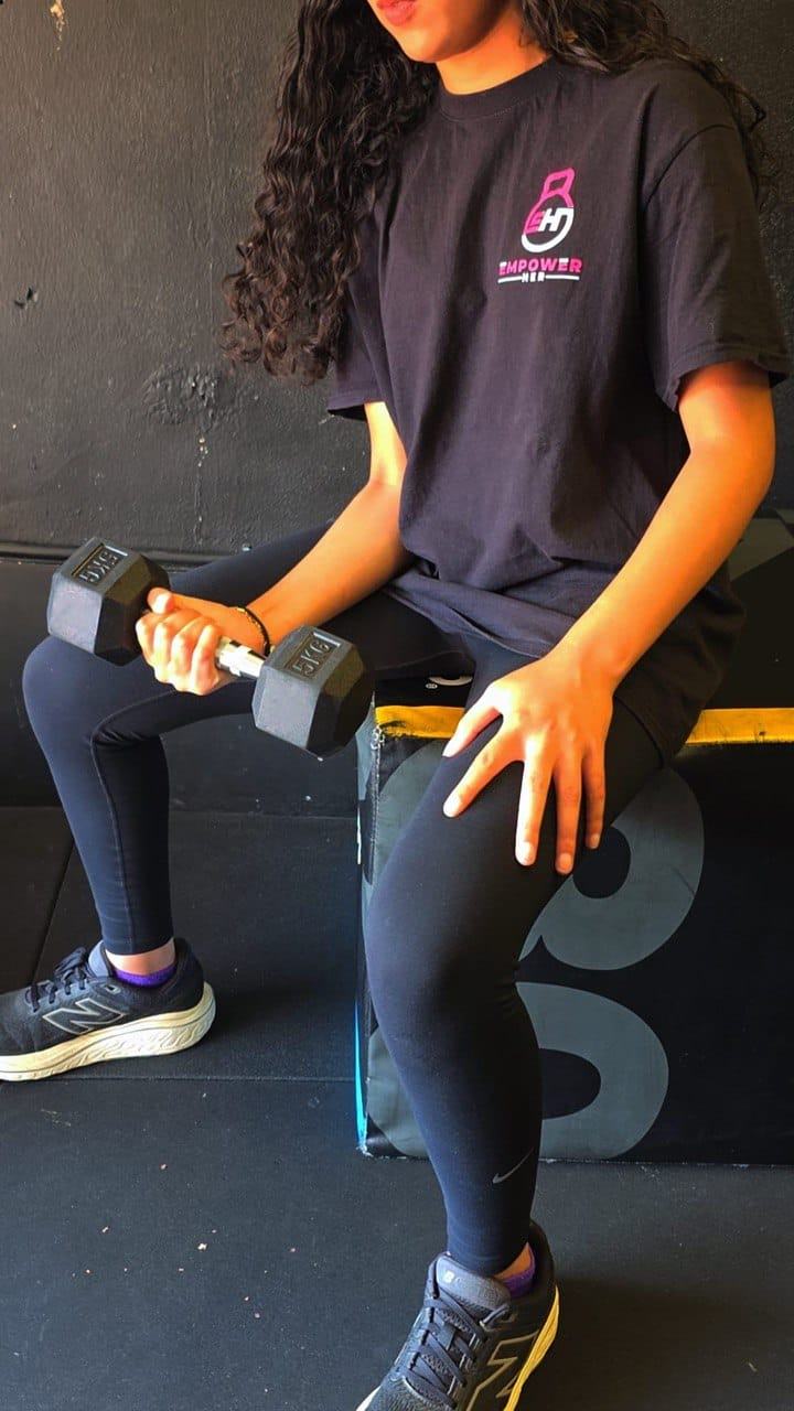 Member lifting dumbbells