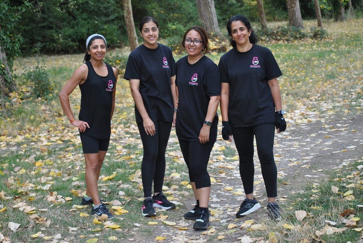 The Empower Her community together outdoors