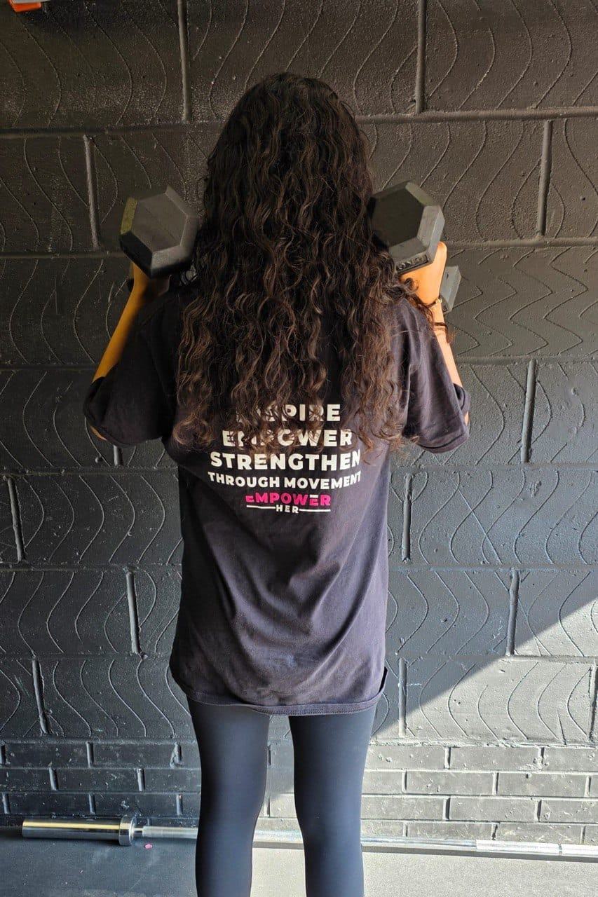 Member training with dumbbells at the Empower Her studio